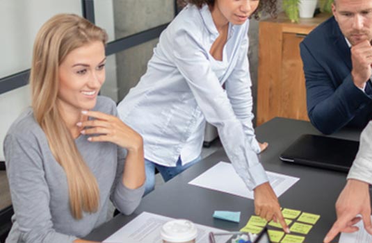 Group of people collaborating at table